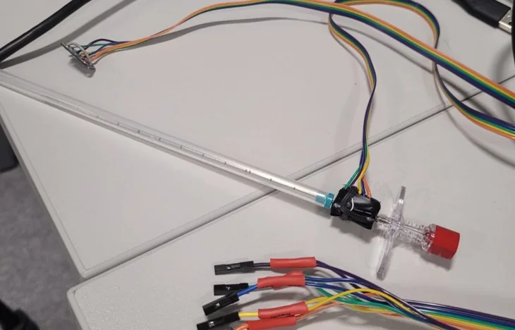 Close view of a sensing prototype mounted near a medical needle